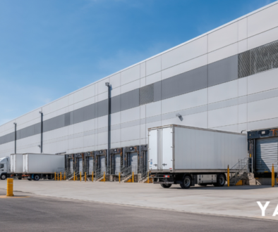 Two commercial trucks parked in a transport yard in metropolitan NSW