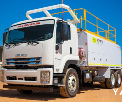 An Isuzu service truck loaded with carpentry tools at a building site in Sydney