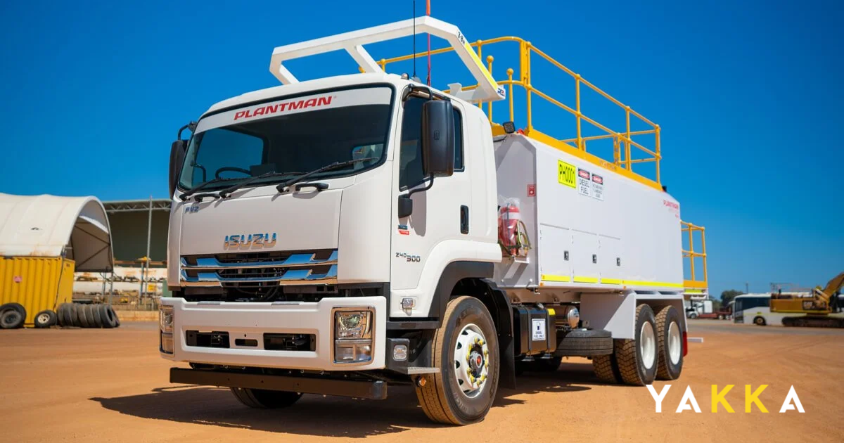 An Isuzu service truck loaded with carpentry tools at a building site in Sydney